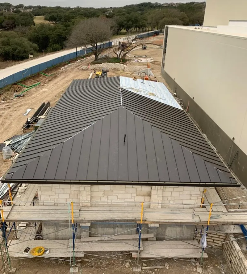 Metal roof new construction with scaffolding in Laurel